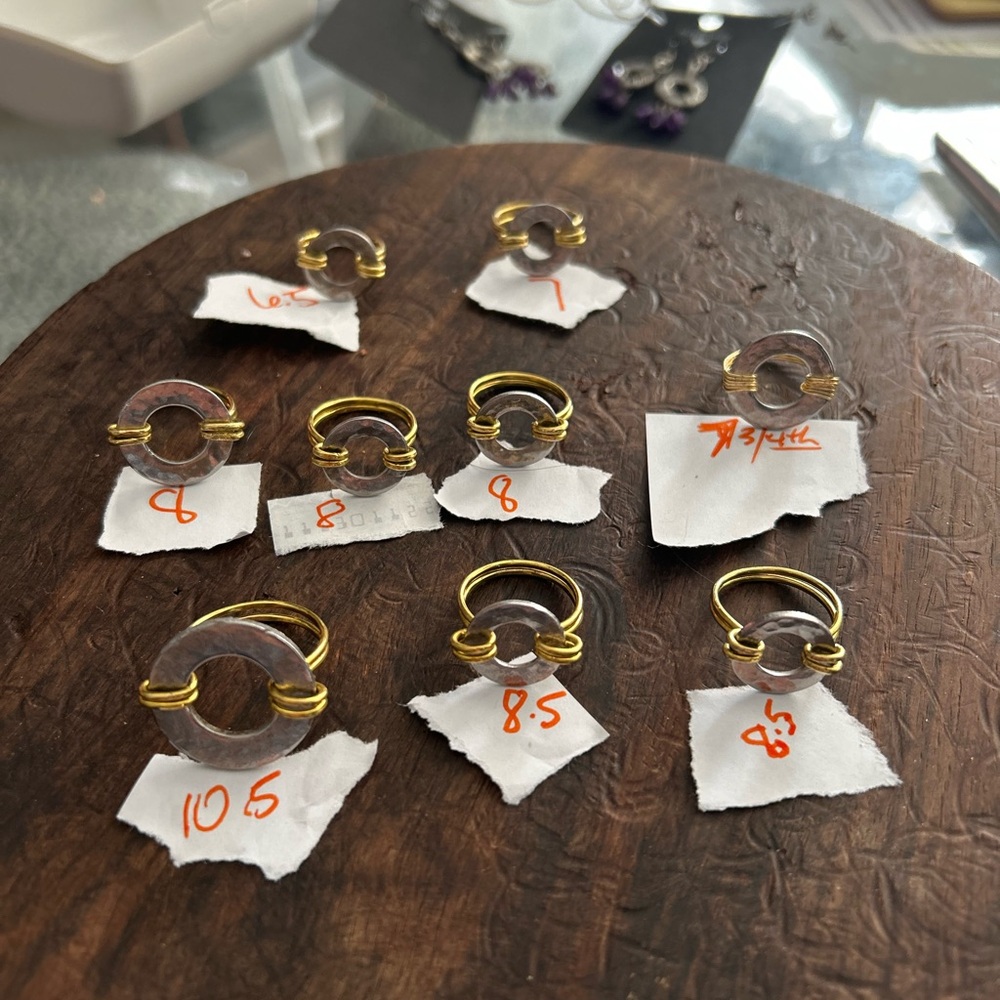 Brass & stainless steel Women's Rings. Assorted sizes.   EACH RING IS $33 each .